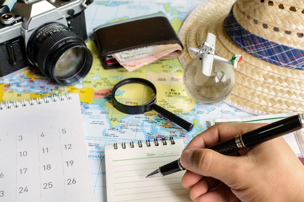 diary and calendar with passport and map